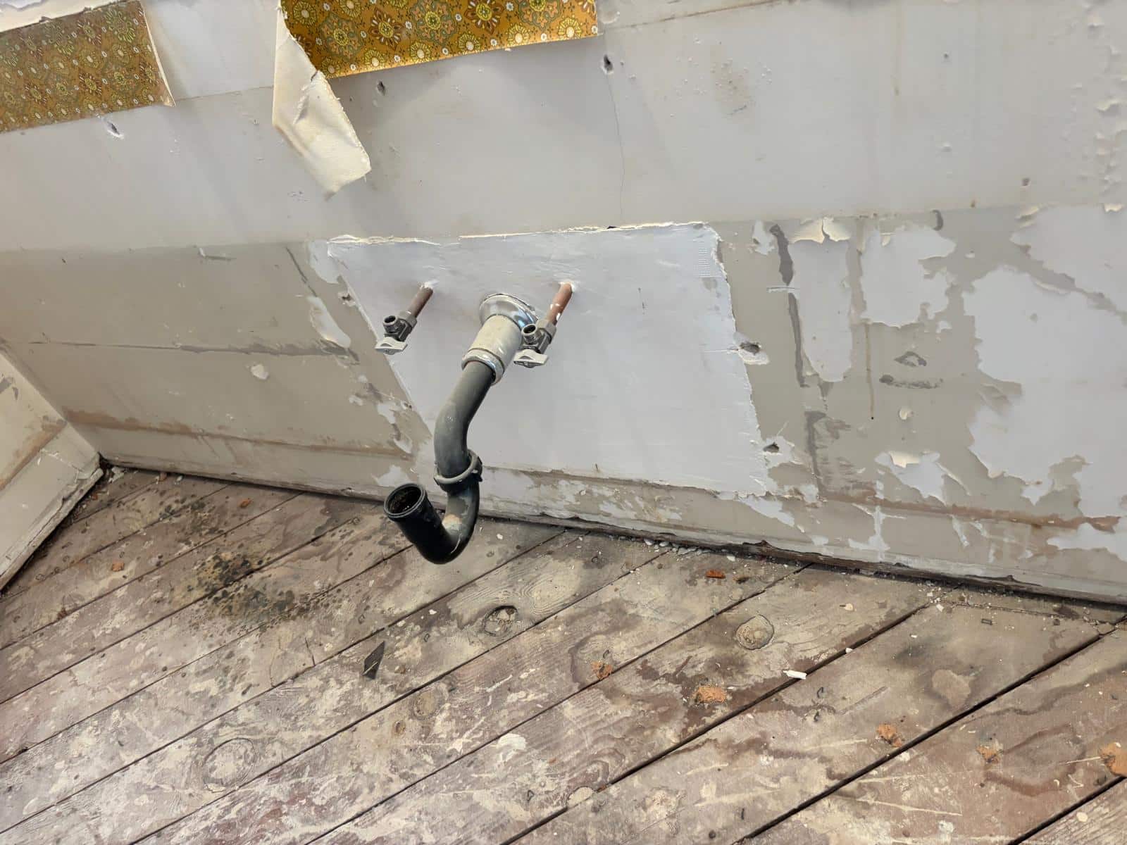 Newly installed copper supply lines and PVC P-traps exposed in wall studs during a Northridge bathroom plumbing rough-in.