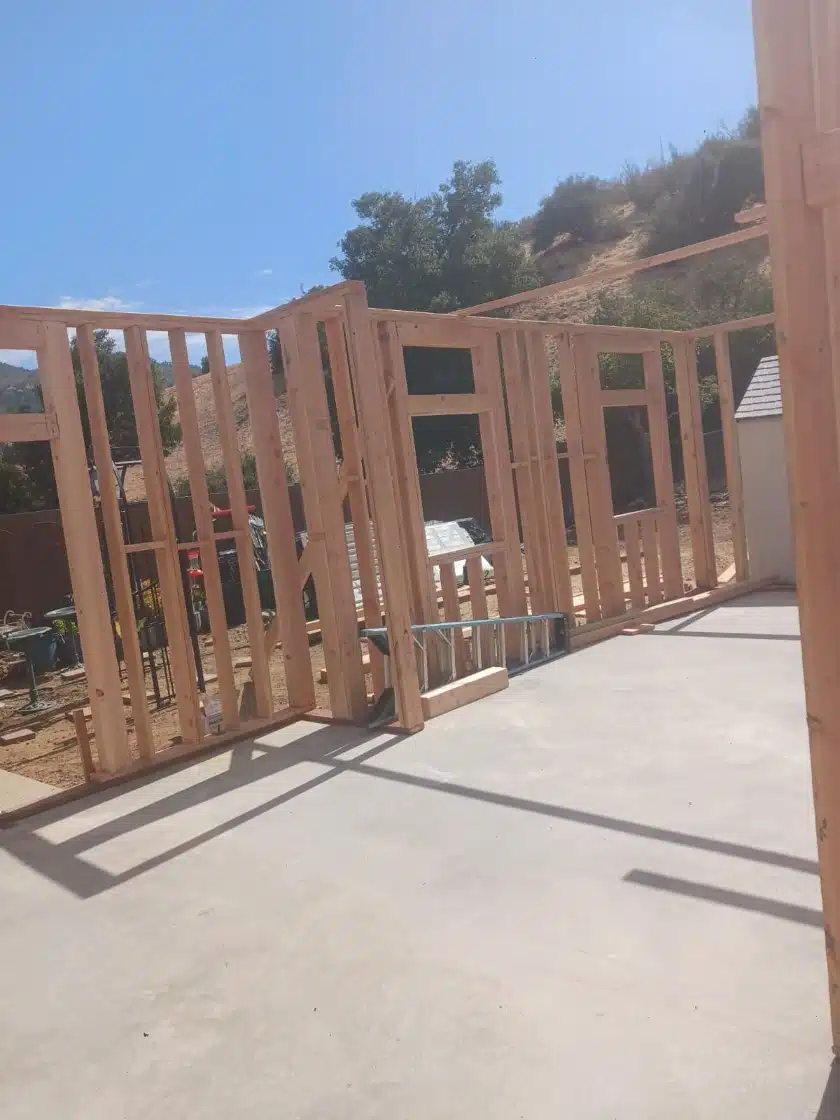 Luxury outdoor cabana under construction in Agoura Hills — open wood framing over a new concrete pad