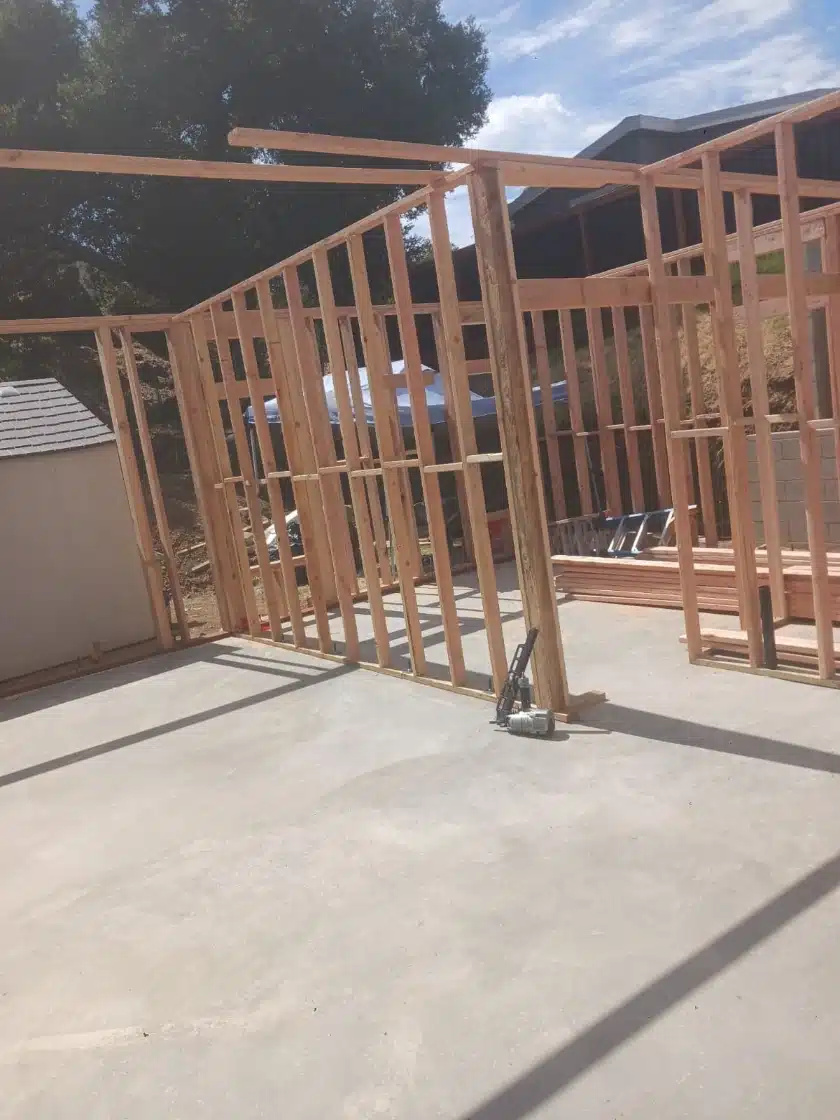 Job-site photo showing initial wood framing and concrete foundation for an outdoor cabana in Agoura Hills.